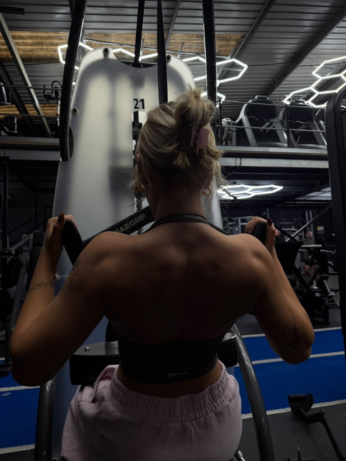 A member training on a pulldown machine.